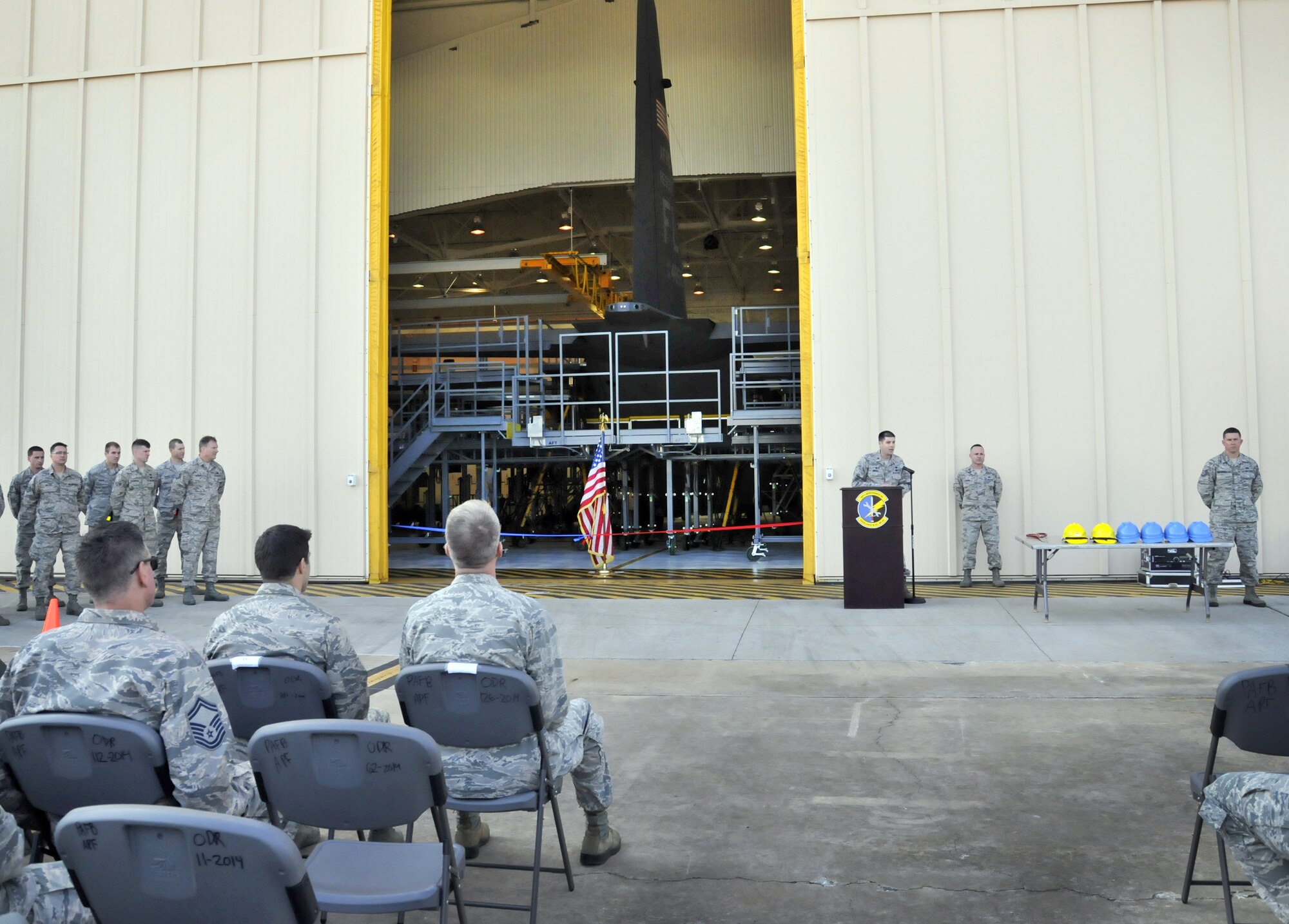 Maj. Aaron Milner, commander of the 920th Aircraft Maintenance Squadron, speaks during a ribbon-cutting ceremony at Hangar 630--the fixed-wing aircraft isochronal inspection (ISO) hangar of the 920th Rescue Wing. The hangar was part of a $4 million multiyear project to expand the structure by roughly 10,000 square feet (from the building's original 17,000) in order to fully enclose the wing's HC-130P/N refueling aircraft. (photo/Senior Airman Natasha Dowridge)