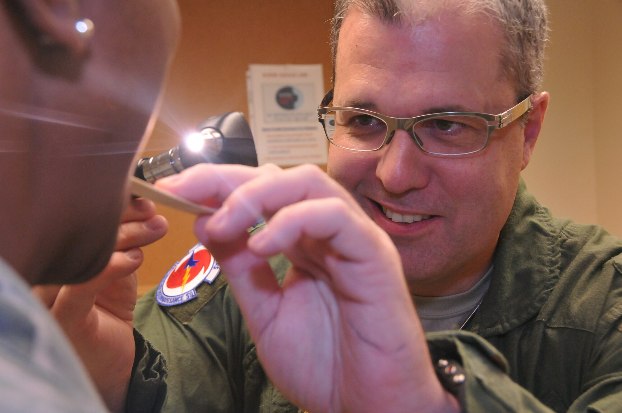 Lt. Col. Huey McDaniel, flight surgeon with the 403rd Aeromedical Staging Squadron, conducts a routine physical exam on a member of the 403rd Wing Jan. 10 at the Keesler Medical Center. The 403rd ASTS provides medical care to members of the wing during UTA weekends. (U.S. Air Force photo / Senior Airman Nicholas Monteleone)