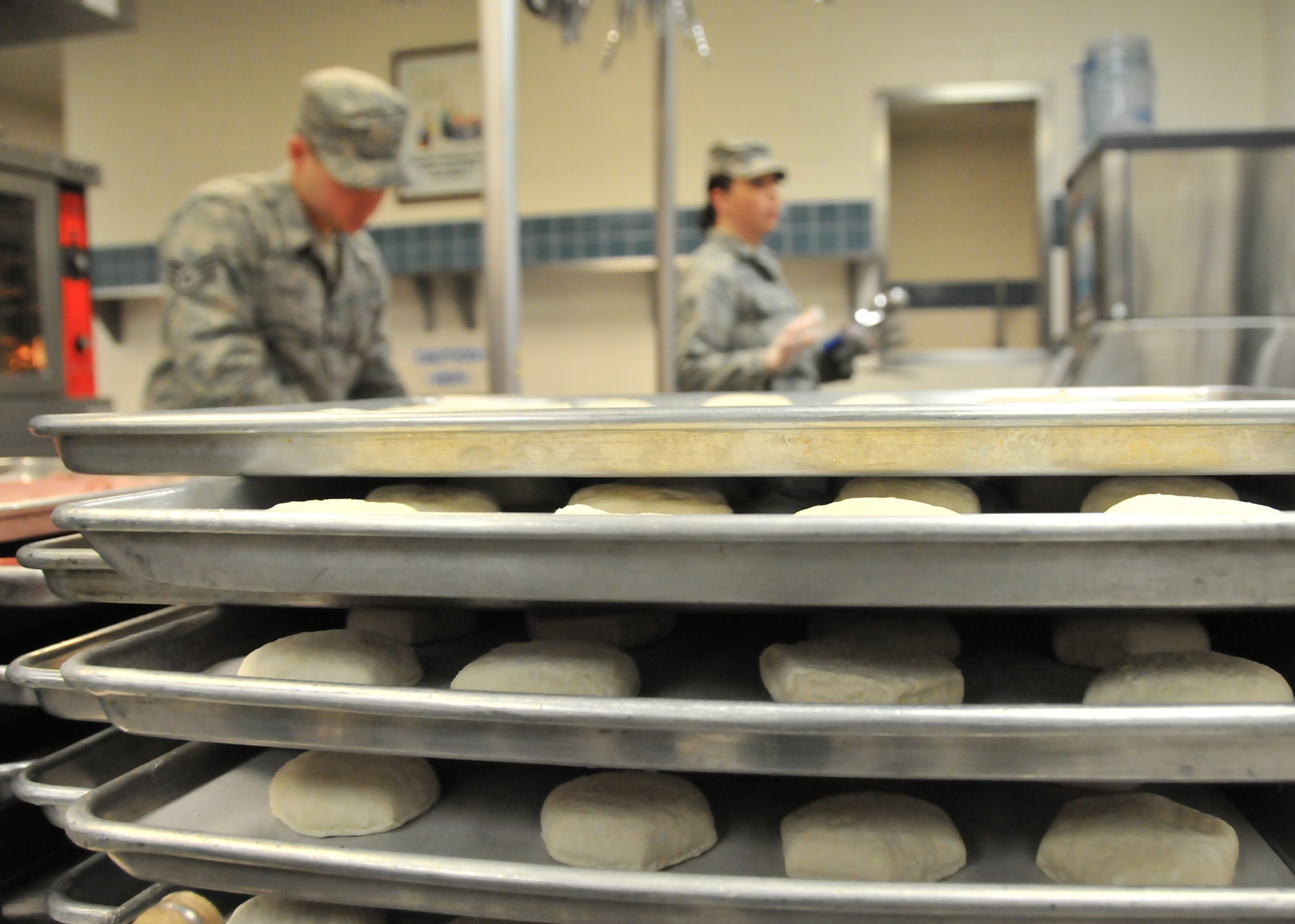 U.S. Air Force Staff Sgt. Jack Hayes and Airman 1st Class Emma Lea, Services specialists assigned to the 153rd Airlift Wing, Wyoming Air National Guard, prepare breakfast food at the 153 AW dining facility Jan. 11, 2015, in Cheyenne, Wyoming. (U.S. Air National Guard photo by Master Sgt. Leisa Grant/released)