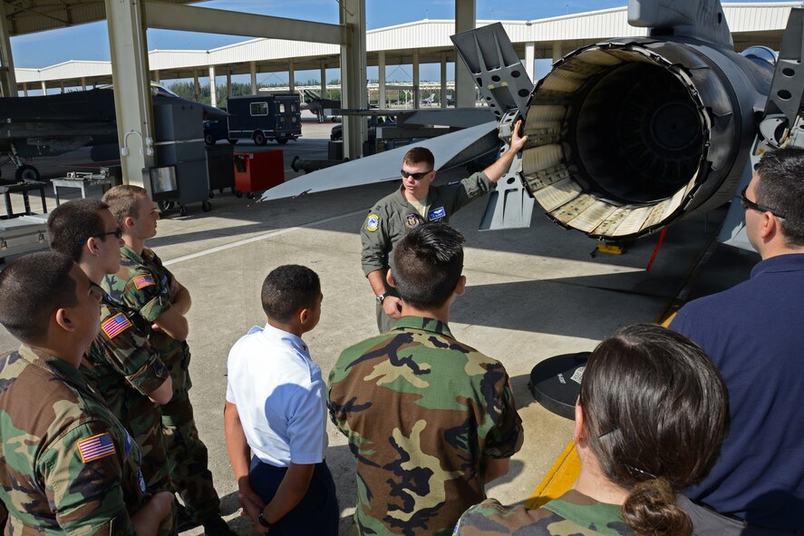 Capt. Scott Morris, 93rd Fighter Squadron pilot, explains the functions of the air braking system on a F-16 Mako fighter jet at Homestead Air Reserve Base, Fla., Jan 10. Members of the Civil Air Patrol from various locations in south Florida toured Homestead ARB Jan 10. (U.S. Air Force photo/Senior Airman Nicholas Caceres)