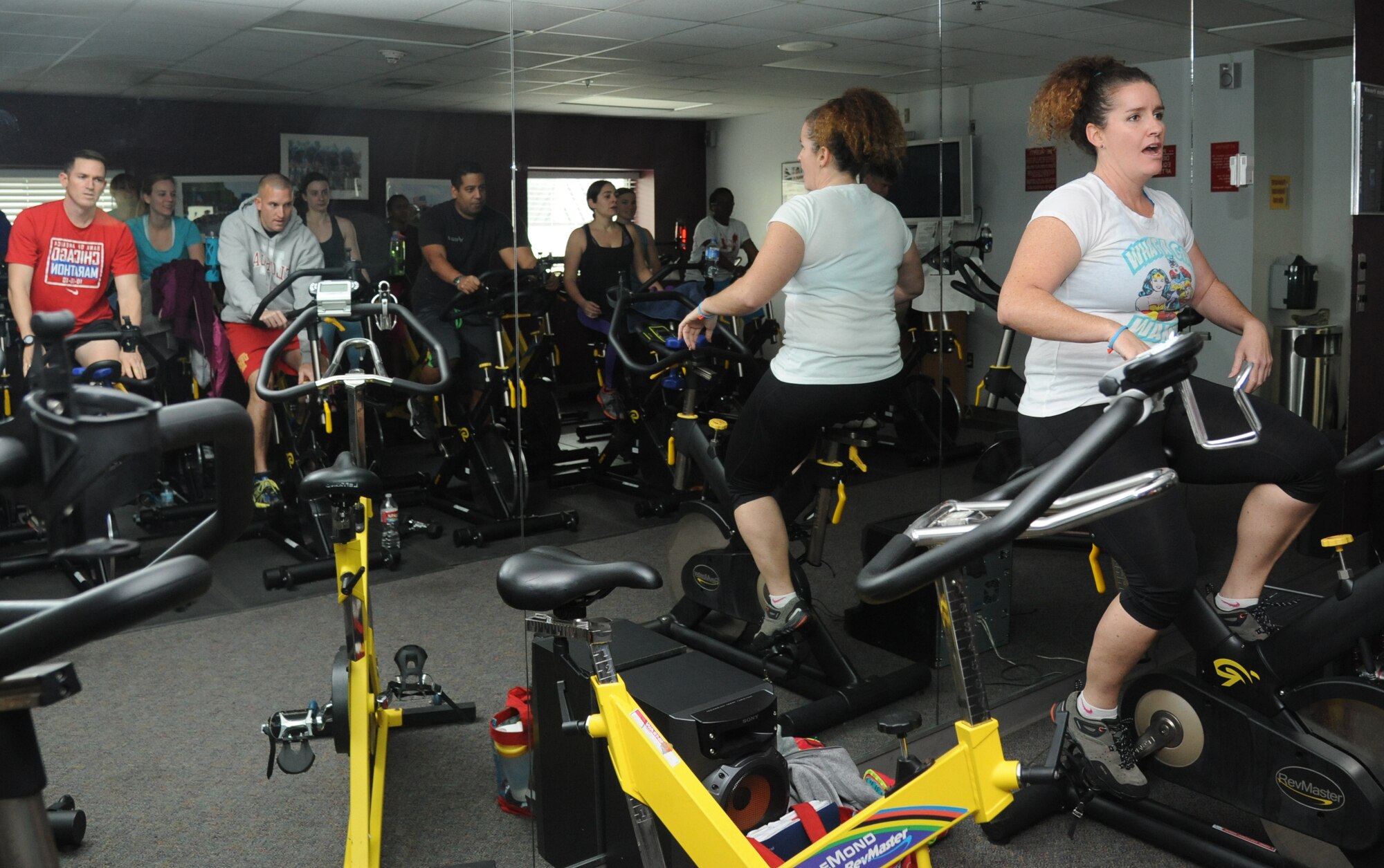 Instructor Cathryn Jensen leads the cycling class at the Dragon Fitness Center Jan. 9, 2015, at Keesler Air Force Base, Miss. Jensen leads cycling, high intensity interval training and step classes on base. She said she wants to empower her students to reach new fitness goals. Her New Year’s resolution is to be able to climb a rope by the end of the year. (U.S. Air Force photo by Kemberly Groue)