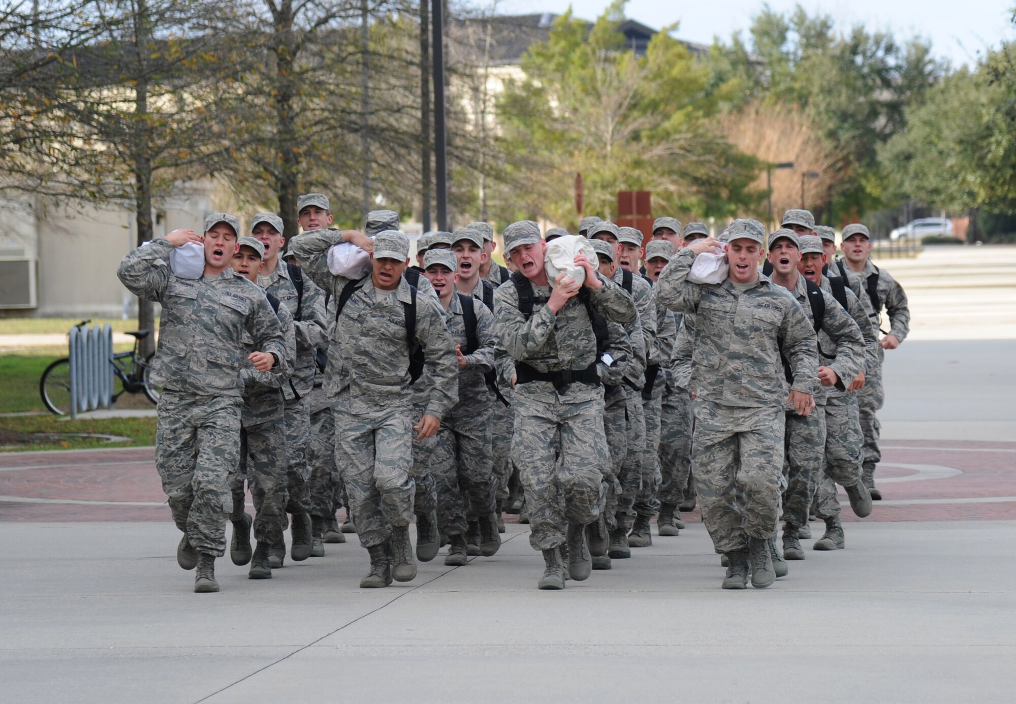 Trainees from the 334th Training Squadron combat control course and the 335th Training Squadron special operations weather  course participate in a 6-mile run during a physical training session Jan. 9, 2015, at Keesler Air Force Base, Miss. These trainees are part of an elite group of Airmen with special physical requirements. Cardiovascular exercise is an essential part of their training. (U.S. Air Force photo by Kemberly Groue)