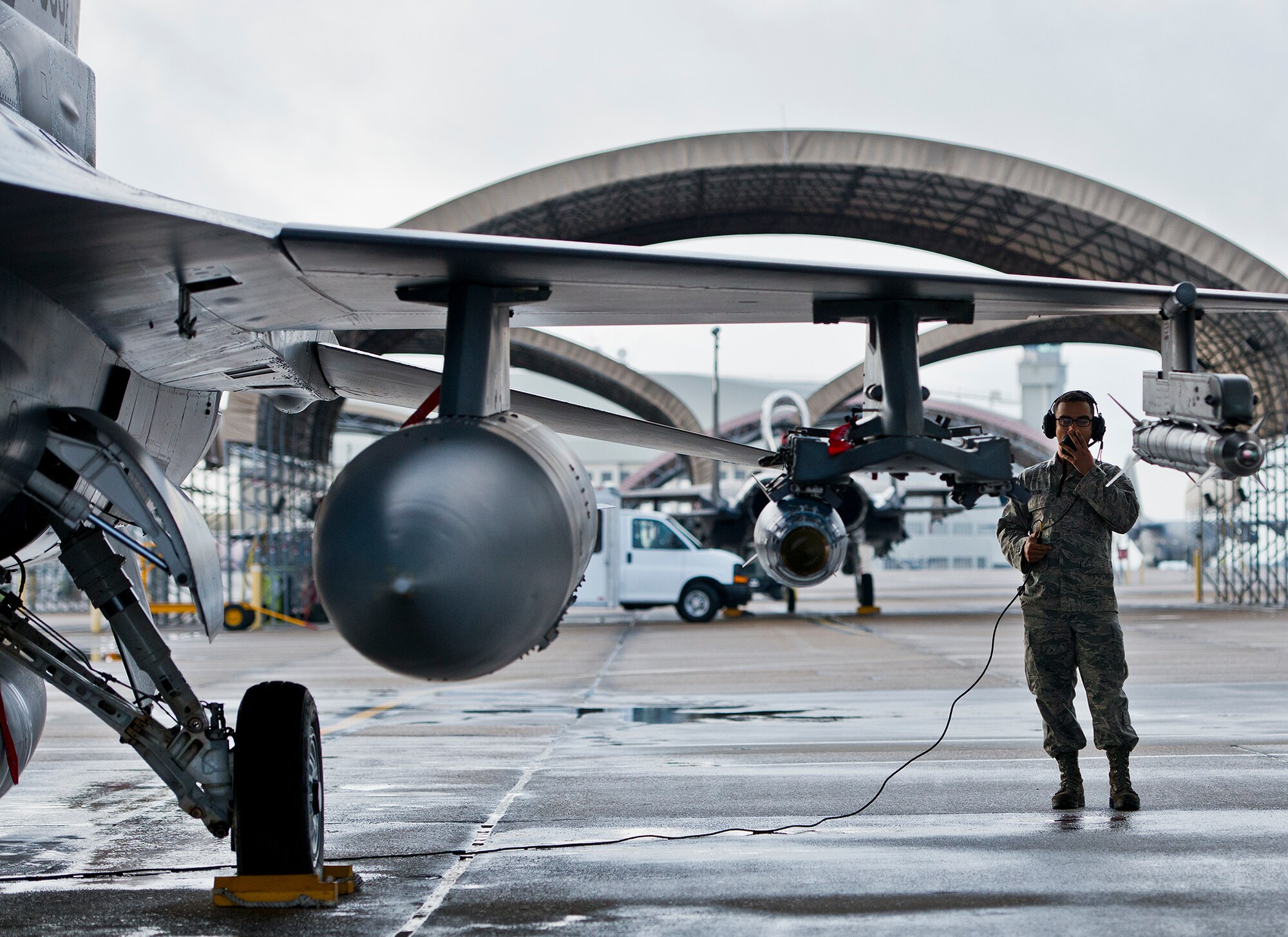 Senior Airman Roderick Ponton, a 96th Aircraft Maintenance Squadron crew chief, talks with the pilot during preflight checks on an F-16 Fighting Falcon prior to a morning sortie at Eglin Air Force Base, Fla.  The 96th AMXS is responsible for the maintenance of all the test aircraft for the 96th Test Wing and the 85th Test and Evaluation Squadron.  (U.S. Air Force photo/Samuel King Jr.)