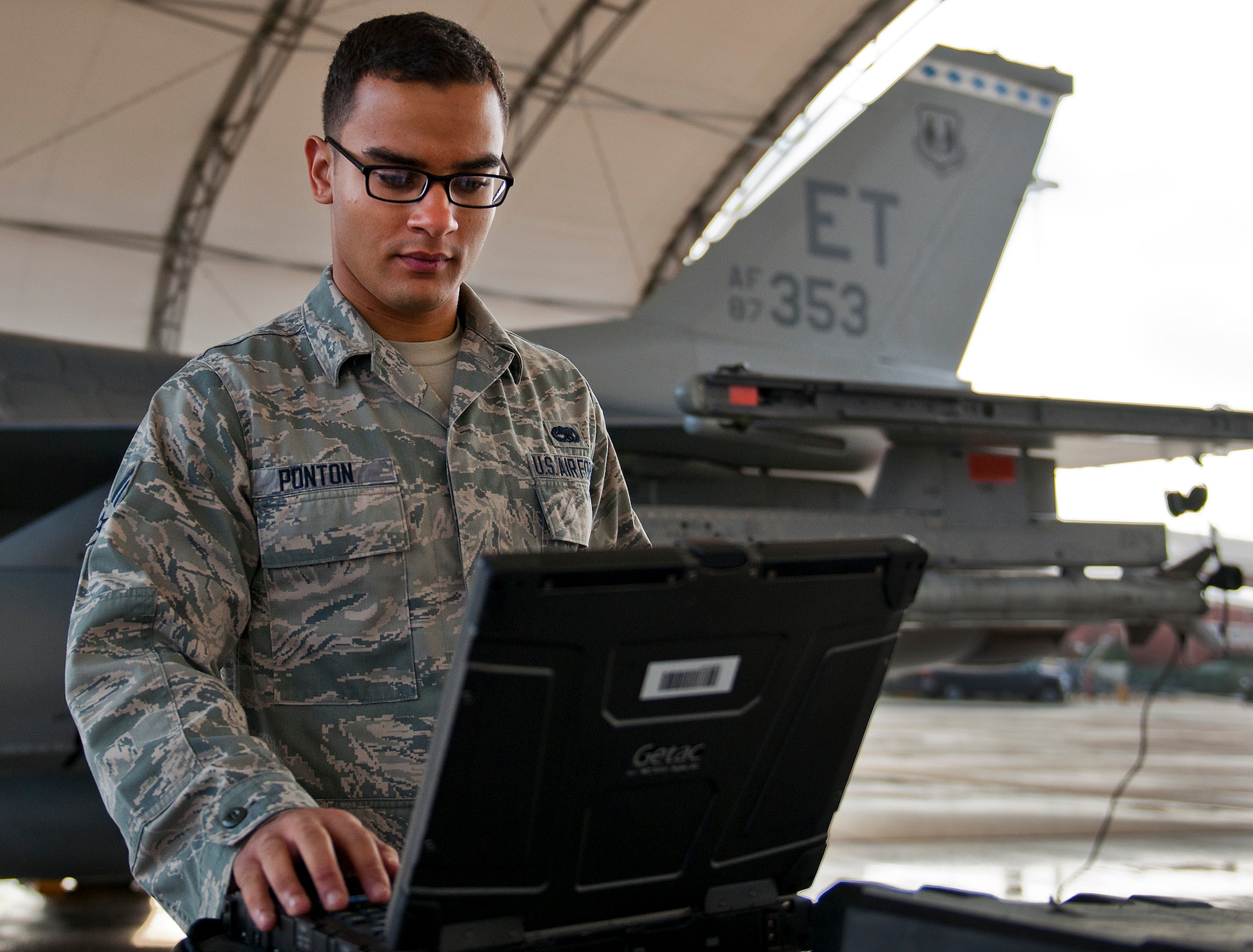 Senior Airman Roderick Ponton, a 96th Aircraft Maintenance Squadron crew chief, performs a preflight check on his F-16 Fighting Falcon prior to a morning sortie at Eglin Air Force Base, Fla.  The 96th AMXS is responsible for the maintenance of all the test aircraft for the 96th Test Wing and the 85th Test and Evaluation Squadron.  (U.S. Air Force photo/Samuel King Jr.)