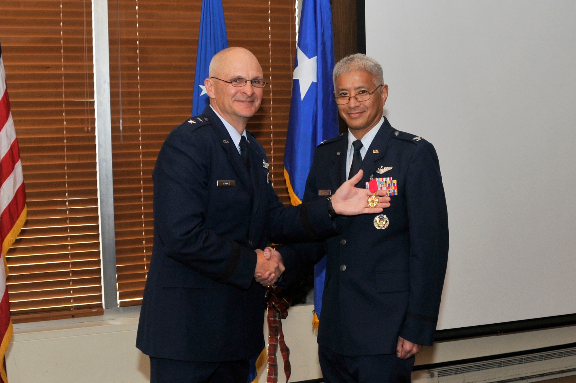 Col. Patrick Tom is retiring from the U.S. Air Force after 25 years of service. A Chief of Staff of the Air Force-designated Senior Materiel Leader, Col. Tom has served as the Chief of the Test Operations Division at Arnold Engineering Development Complex (AEDC) prior to his deployment in March 2014. To recognize his many achievements, family, friends and coworkers recently gathered at a luncheon and ceremony in his honor. The presiding official for the ceremony was Major General Arnold W. Bunch Jr., commander of the Air Force Test Center. Tom’s family in attendance included his wife Roberta and brother Donald. His mother Nancy was also able to watch the ceremony from Honolulu, Hawaii, via Skype. Pictured is Col. Tom, right, accepting the Legion of Merit Medal from Maj. Gen. Bunch. (Photo by Jacqueline Cowan)