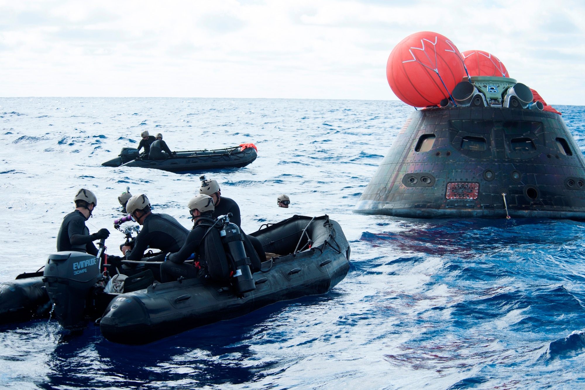 NASA's Orion spacecraft awaits the U.S. Navy's USS Anchorage for a ride home. Orion launched into space on a two-orbit, 4.5-hour test flight at 7:05 am EST on Dec. 5, and safely splashed down in the Pacific Ocean, where a combined team from NASA, the Navy and Orion prime contractor Lockheed Martin retrieved it for return to shore on board the Anchorage. (U.S. Navy Photo) 
