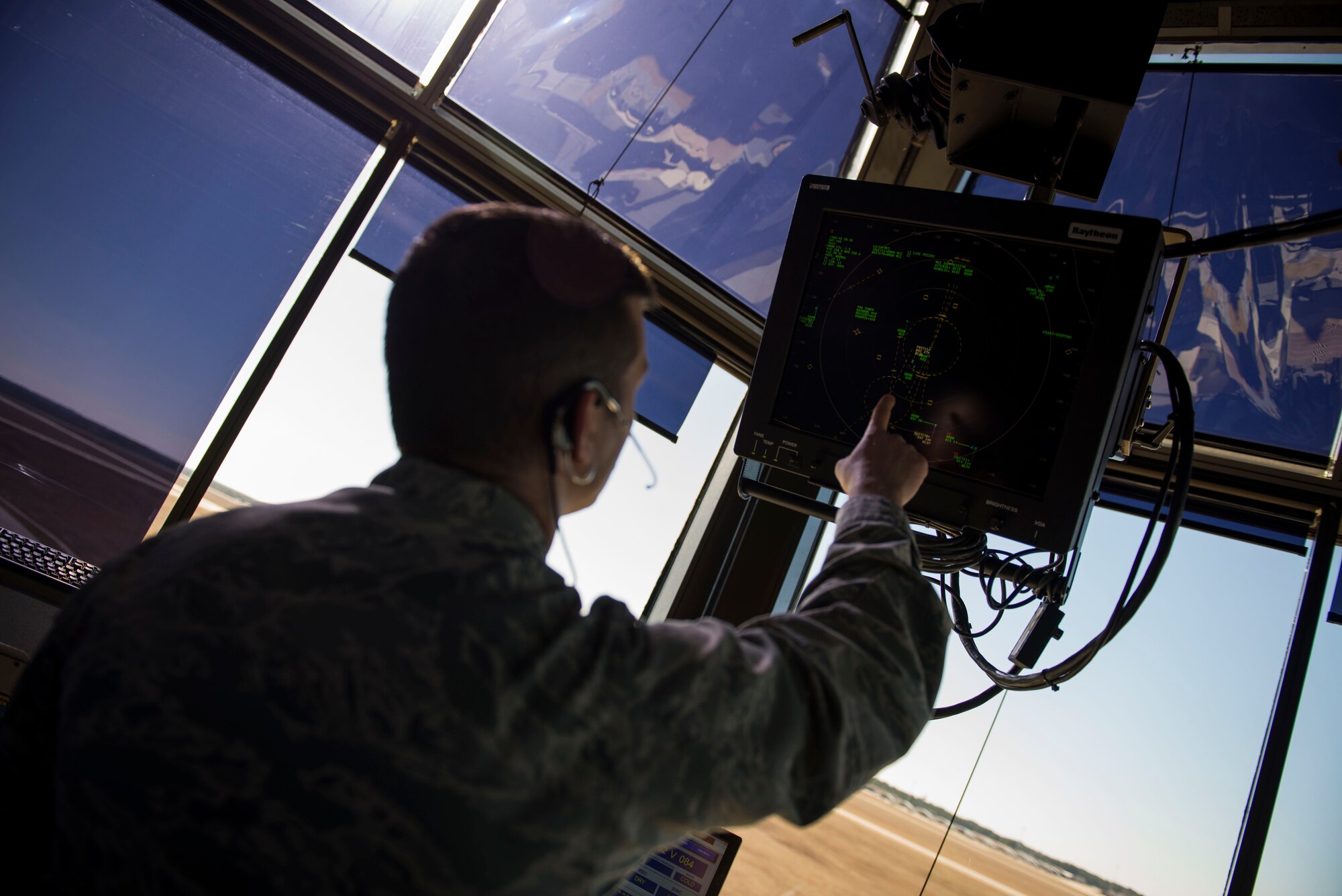 U.S. Air Force 2nd Lt. Ryan Bachelor, 23d Operations Support Squadron airfield operations officer, monitors aircraft flying over Moody Air Force Base, Ga., Jan. 8, 2015. Bachelor monitors the in-flight aircraft to ensure they keep a safe distance apart when flying. (U.S. Air Force photo by Airman 1st Class Dillian Bamman/Released)
