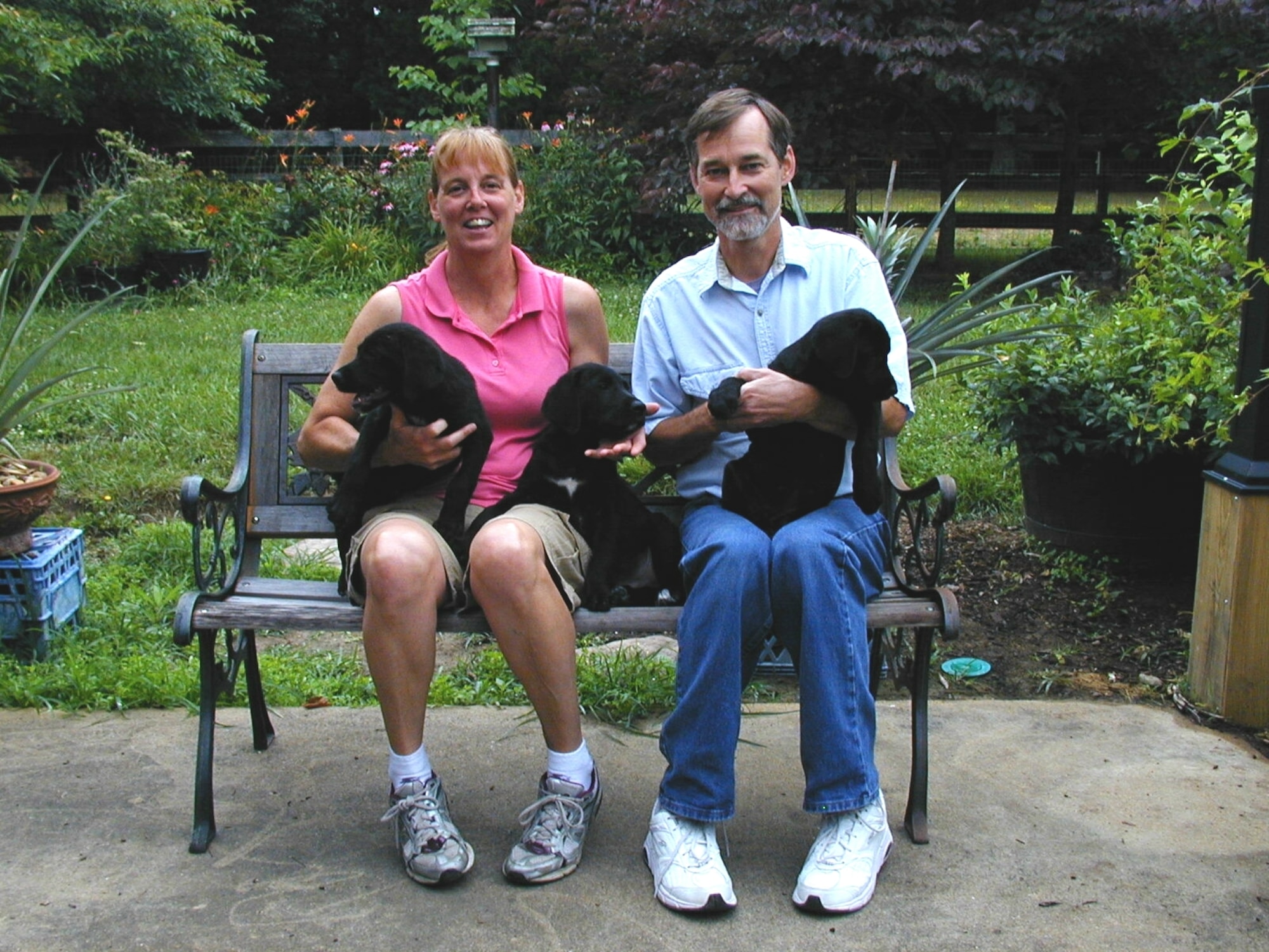 Al Milhoan and his wife Jennifer with the three Labradors they adopted not long before Al was diagnosed with cancer. (Photo provided)