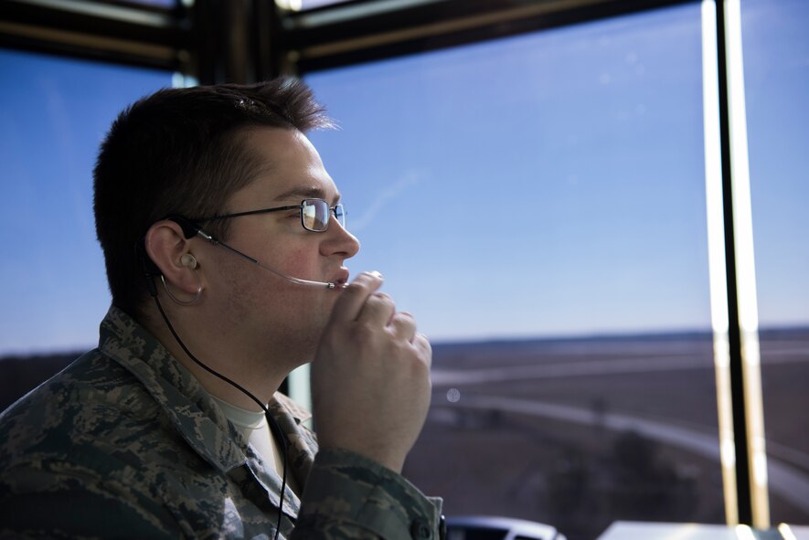 U.S. Air Force Staff Sgt. Patrick Beargie, 23d Operations Support Squadron air traffic controller, communicates with local air traffic controllers Jan. 8, 2015, at Moody Air Force Base, Ga. Beargie and his ATC team use enhanced terminal voice switches to communicate by telephone lines, air-ground radios and intercommunications. (U.S. Air Force photo by Airman 1st Class Dillian Bamman/Released)
