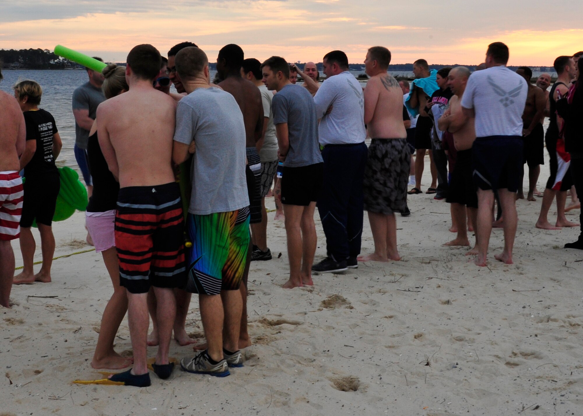 A group of participants huddle together at the starting line of Eglin’s annual Polar Bear Plunge at Post’l Point, Jan. 9.  Approximately 50 people braved frigid morning temperatures to rush into the 57 degree water.  According to local weather reports, it was 32 degrees with a 27 degree wind chill factor.  (U.S. Air Force photo/Ilka Cole) 