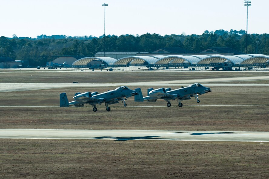 Two A-10C Thunderbolt IIs take off toward the skies of Valdosta, Ga., Jan. 8, 2015, at Moody Air Force Base, Ga. Moody’s air traffic control team tracks all Moody aircraft to provide a safe flow of aircraft on the flightline and in the air.  (U.S. Air Force photo by Airman 1st Class Dillian Bamman/Released)
