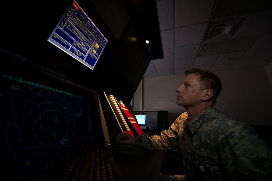 U.S. Air Force Airman 1st Class Brandon Gray, 23d Operations Support Squadron air traffic control apprentice, tracks aircraft flying over Moody Air Force Base using a radar approach control (RAPCON) simulator Jan. 8, 2015, at Moody AFB, Ga. To work in a control tower or RAPCON operations center, ATC Airmen are required to recertify their Federal Aviation Administration Specialist certification at each new duty station. (U.S. Air Force photo by Airman 1st Class Dillian Bamman/Released)
