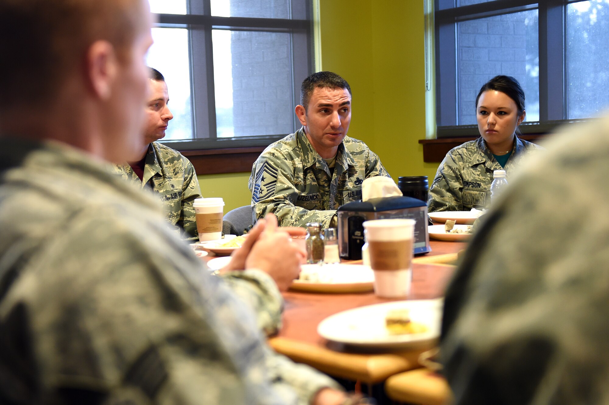 Chief Master Sgt. Brian Kruzelnick, 460th Space Wing command chief, takes notes during a breakfast with Airmen and the 460th SW commander, Col. John Wagner, Jan. 9, 2015, at the Panther Den on Buckley Air Force Base, Colo. During the breakfast, leadership sought out Airmen’s thoughts and opinions on what they could do to make Buckley the best base in the Air Force. (U.S. Air Force photo by Airman 1st Class Emily E. Amyotte/Released)