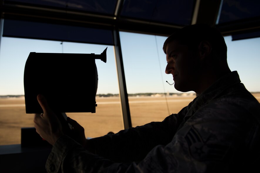 U.S. Air Force Senior Airman Joshua Dermody, 23d Operations Support Squadron air traffic control journeyman, demonstrates the use of a light gun Jan. 8, 2015, at Moody Air Force Base, Ga. ATC Airmen use the light gun to communicate with aircraft that have disrupted or failed telecommunications. (U.S. Air Force photo by Airman 1st Class Dillian Bamman/Released)
