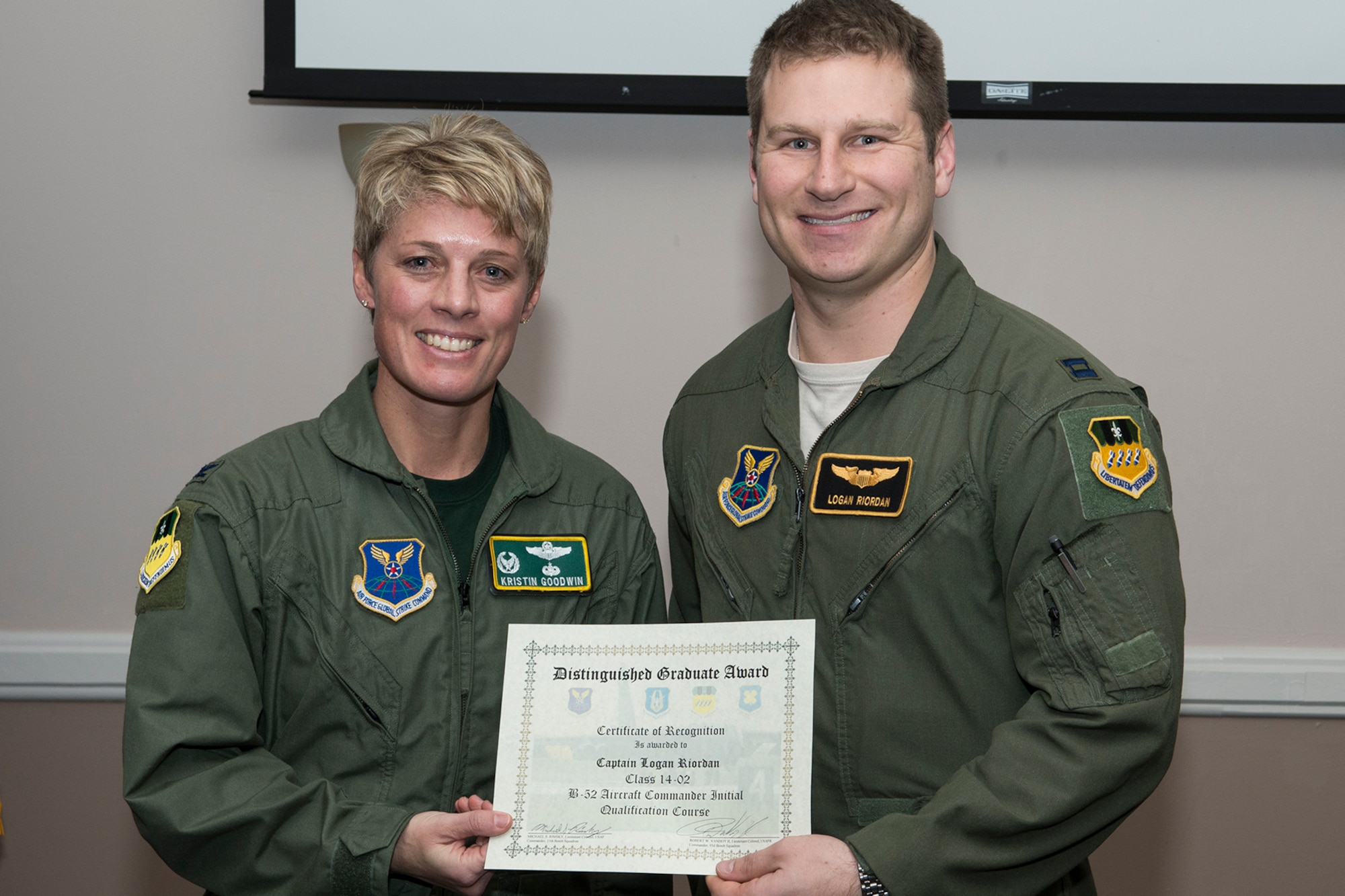 U.S. Air Force Col. Kristin Goodwin, 2nd Bomb Wing commander, presents the Distinguished Graduate Award to Capt. Logan Riordan during a Formal Training Unit (FTU) graduation ceremony, Jan. 9, 2015, Barksdale Air Force Base, La. Riordan graduated from the FTU as an Aircraft Commander on the B-52H Stratofortress. (U.S. Air Force photo by Master Sgt. Greg Steele/Released)
