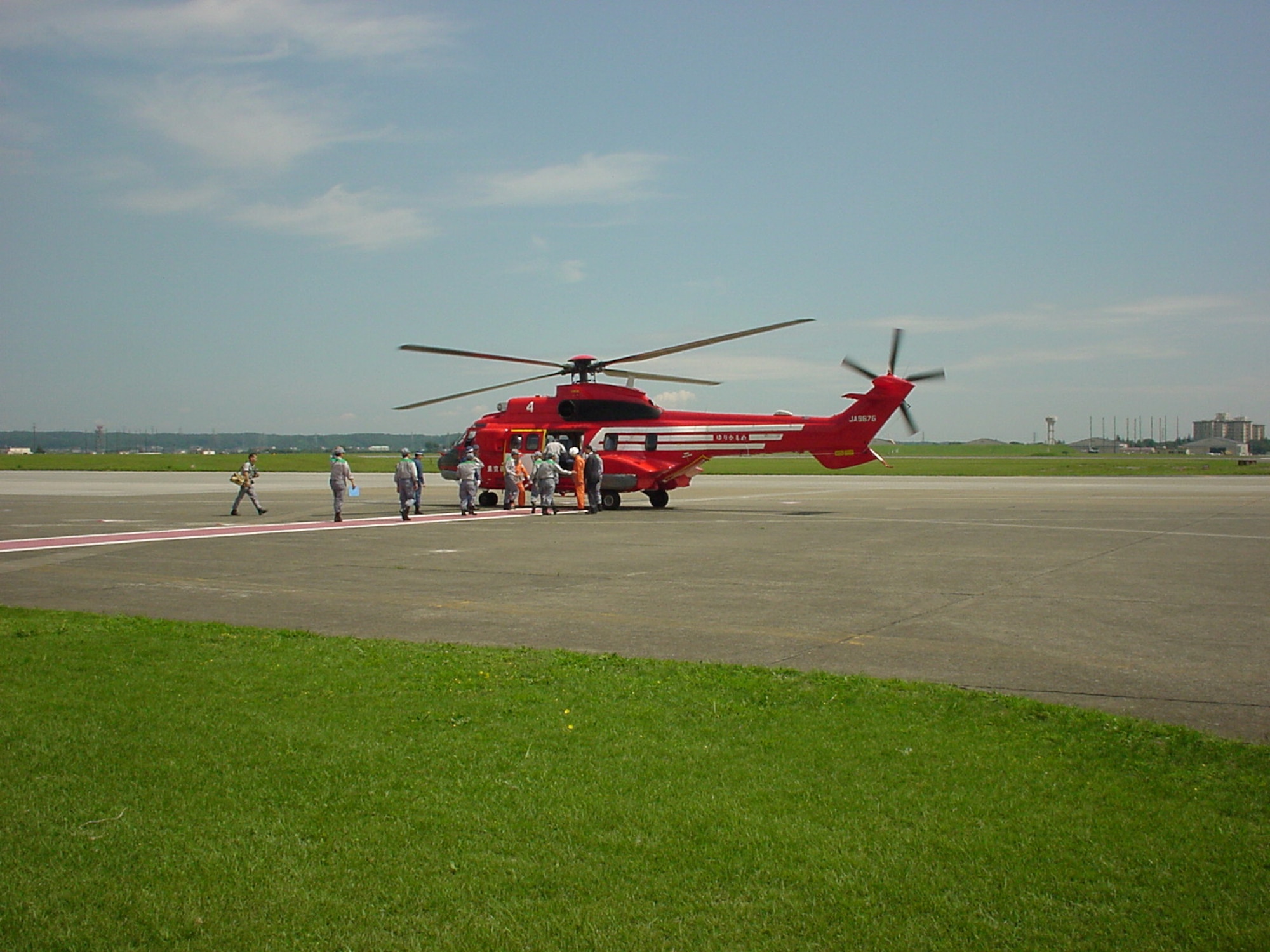 Tokyo Metropolitan Government officials board a helicopter at Yokota
during the city's annual Disaster Response Exercise. (Photo courtesy of the 374 AW History
Office.)
