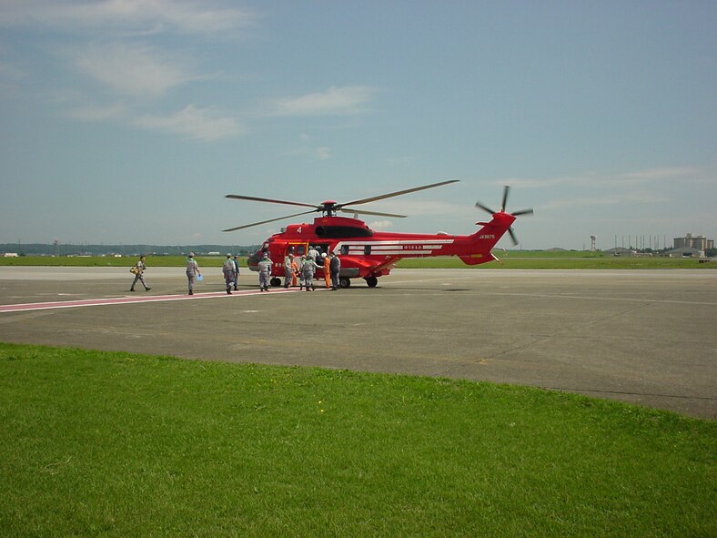 Tokyo Metropolitan Government officials board a helicopter at Yokota
during the city's annual Disaster Response Exercise. (Photo courtesy of the 374 AW History
Office.)
