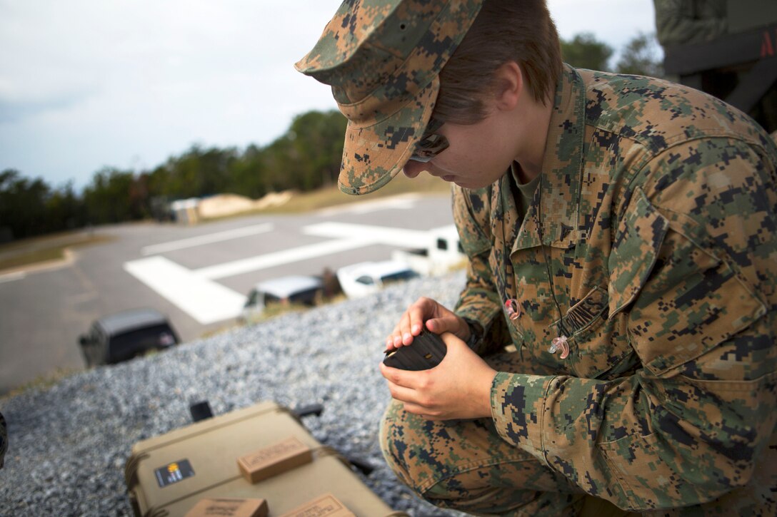 U.S. Marine Corps Lance Cpl. Jordan Penney loads 7.62 mm ammunition before firing an M110 semi-automatic Sniper System during marksmanship and observer training on Camp Hansen, Okinawa, Japan, Jan. 6, 2015. Penney is assigned to the 3rd Marine Expeditionary Force, Special Reaction Team.