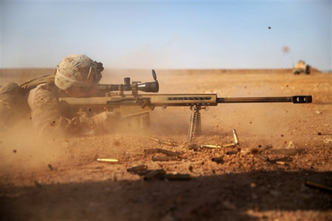 U.S. Marine Cpl. Kaden Prickett fires a .50-caliber scoped rifle at a target 1,200 meters away in the U.S. Central Command area of operations, Jan. 6, 2015. Prickett is a machine gunner and team leader assigned to Golf Company, 2nd Battalion, 7th Marine Regiment, Special Purpose Marine Air Ground Task Force-Crisis Response.