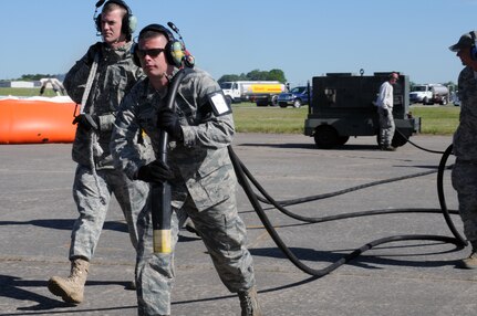 Maintenance technicians from the 145th Airlift Wing of the North Carolina Air National Guard service and reload an aircraft preparing for another Modular Airborne Firefighting Systems (MAFFS) training mission in Greenville, S.C., April 26-30, 2010.