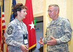 Army Maj. Gen. Larry H. Ross, director of manpower and personnel at the National Guard Bureau talks with  Command Chief Master Sgt. Denise Jelinski-Hall, NGB’s senior enlisted leader, during a break at this year’s National Guard Health Promotion and Annual Training Prevention Workshop at Buck Head’s Grand Hyatt Hotel in Atlanta, Ga., April 27, 2010.