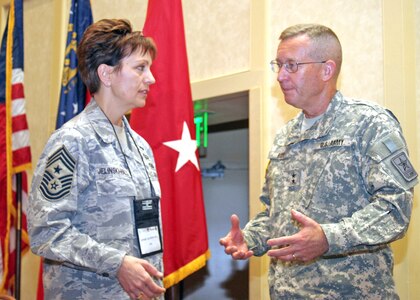 Army Maj. Gen. Larry H. Ross, director of manpower and personnel at the National Guard Bureau talks with  Command Chief Master Sgt. Denise Jelinski-Hall, NGB’s senior enlisted leader, during a break at this year’s National Guard Health Promotion and Annual Training Prevention Workshop at Buck Head’s Grand Hyatt Hotel in Atlanta, Ga., April 27, 2010.