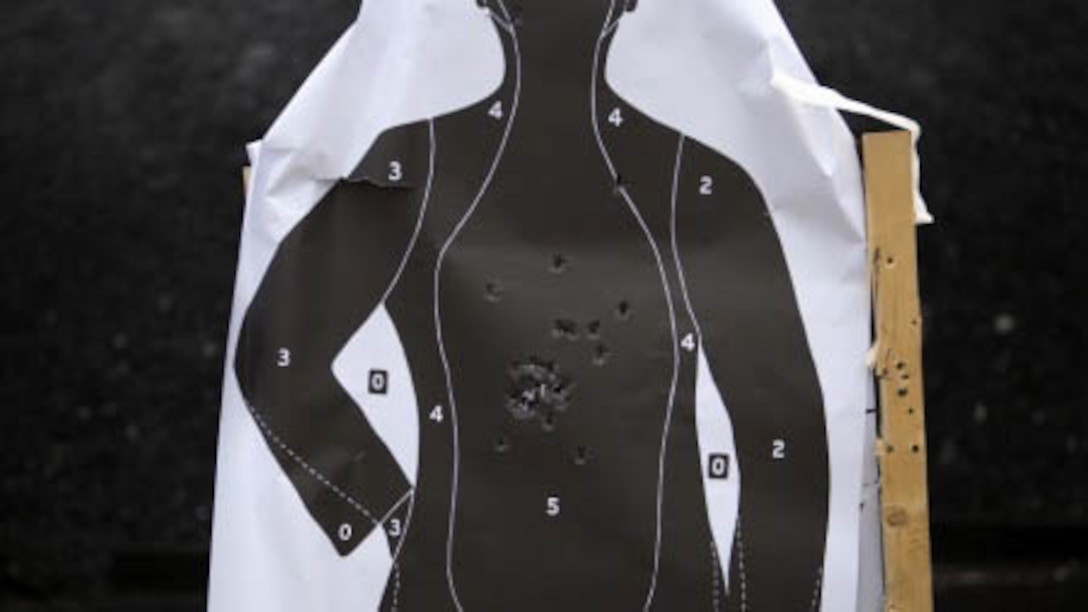 A target stands littered with impact points from Marines qualifying with their weapons Jan. 8 on Camp Hansen. The Marines are with Special Reaction Team, Camp Foster Provost Marshal’s Office, Marine Corps Installations Pacific-Marine Corps Base Camp Butler, Japan. The SRT qualified on a number of different weapons, including shotguns, service rifles and pistols. The team is the military equivalent of Special Weapons and Tactics teams. 