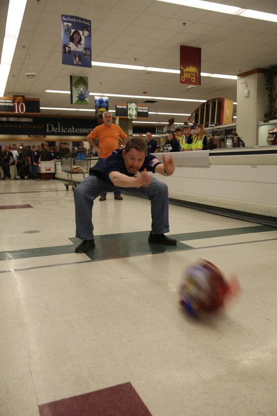 Lyle Mclan, a Special Olympics athlete, competes in the crowd favorite, the Turkey Bowl, during the commissary’s 8th annual Special Olympics at Marine Corps Air Station Cherry Point, N.C., Jan. 12, 2015. Dozens of volunteers cheered as more than 50 athletes competed in the games to win various prizes.