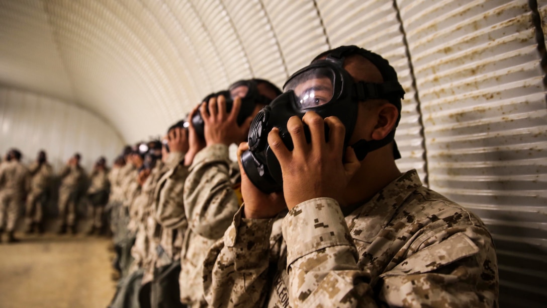 Recruits of Golf Company, 2nd Recruit Training Battaliom, endure the effects of chlorobenzylidene malonitrile, or CS gas, a non-lethal tear gas and riot control agent at Weapons and Field Training Battalion, Marine Corps Base Camp Pendleton Calif., Dec. 8.Recruits were required to perform three exercises while in the chamber. They shake their heads to demonstrate a correct seal of the mask, they conduct jumping jacks to elevate their heart rates, and finally are required to break the seal of the mask to expose their faces to the gas.