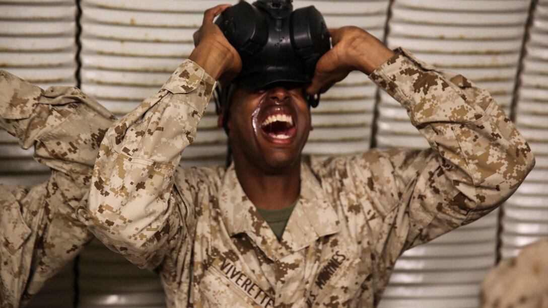 Recruit Devontae Viverette, Platoon 2150, Golf Company, 2nd Recruit Training Battaliom, endure the effects of chlorobenzylidene malonitrile, or CS gas, a non-lethal tear gas and riot control agent at Weapons and Field Training Battalion, Marine Corps Base Camp Pendleton Calif., Dec. 8. The chemicals in the gas cause a burning sensation to the skin and are particularly stringent to the eyes, ears and mouth. Most recruits wind up with tears streaming down their faces, coughing, runny noses and restricted breathing.