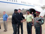 Col. M.C. Mophuting, commandant of the Botswana Defence Force (BDF) Training Establishment, and Col. Baatweng, BDF chief of protocol, greet Gen. William Ward, commander of U.S. Africa Command, upon his arrival in Gaborone, Botswana, April 28, 2010. During Ward's visit, the first since 2007, he was scheduled to meet with senior military and civilian officials to discuss ongoing and future military-to-military and security cooperation engagements. The BDF conducted 40 military-to-military exercises last year making it one of the most active of U.S. Africa Command's partner nations.