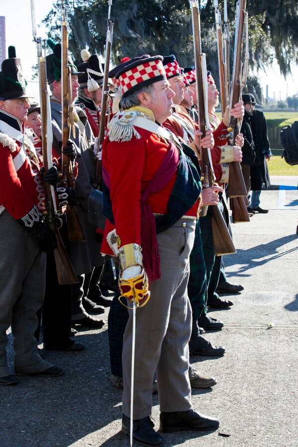 Volunteers reenacting as Scottish Highlanders present arms during a color guard demonstration at the Jean Lafitte National Historic Park and Preserve in New Orleans, Jan. 8, 2015. The park hosted a series of living history events on the Chalmette Battlefield in Chalmette, La., Jan. 8-10 that commemorated the bicentennial of the 1815 Battle of New Orleans. 