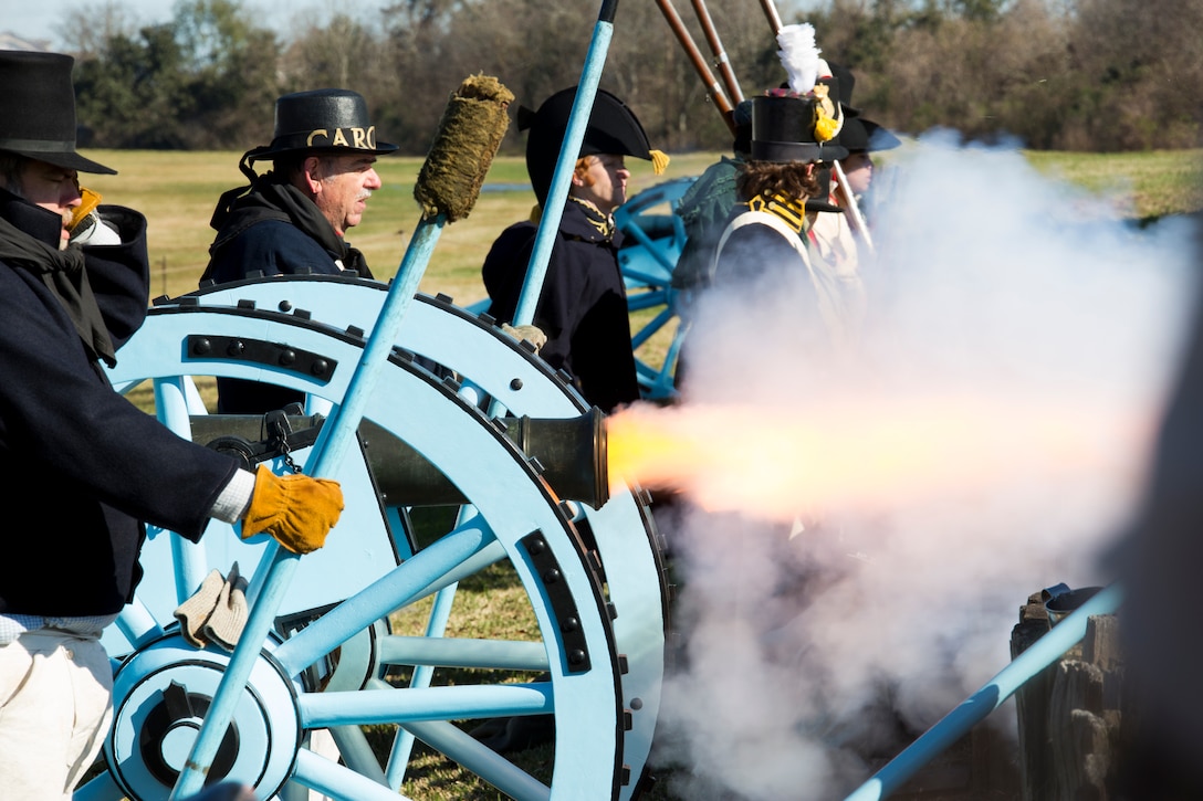 Volunteers reenacting as American troops in the War of 1812 fire a cannon at the Jean Lafitte National Historic Park and Preserve in New Orleans, Jan. 8, 2015.The firing of the cannon marked the beginning of a series of living history events that commemorated the bicentennial of the 1815 Battle of New Orleans.