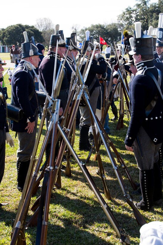 Volunteers reenacting as American soldiers during the War of 1812 stack arms during a demonstration at the Jean Lafitte National Historic Park and Preserve Jan. 8, 2015. The park hosted a series of living history events on the Chalmette Battlefield in Chalmette, La., Jan. 8-10 that commemorated the bicentennial of the 1815 Battle of New Orleans. 
