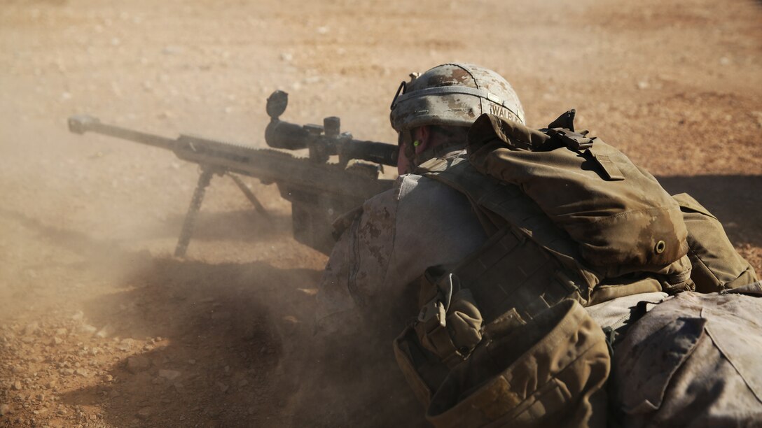 U.S. Marine Lance Cpl. Dalton Walburn, rifleman, Golf Company, 2nd Battalion 7th Marine Regiment, Special Purpose Marine Air Ground Task Force - Crisis Response - Central Command, fires a .50 caliber Special Applications Scoped Rifle at a target 1,200 meters away, in the Central Command area of operations, Jan. 6, 2015. Marines and sailors of Golf Company spent time on the range getting acquainted with various weapons systems and cross-training one another in their respective areas of expertise. (U.S. Marine Corps photo by Cpl. Carson A. Gramley/Released)