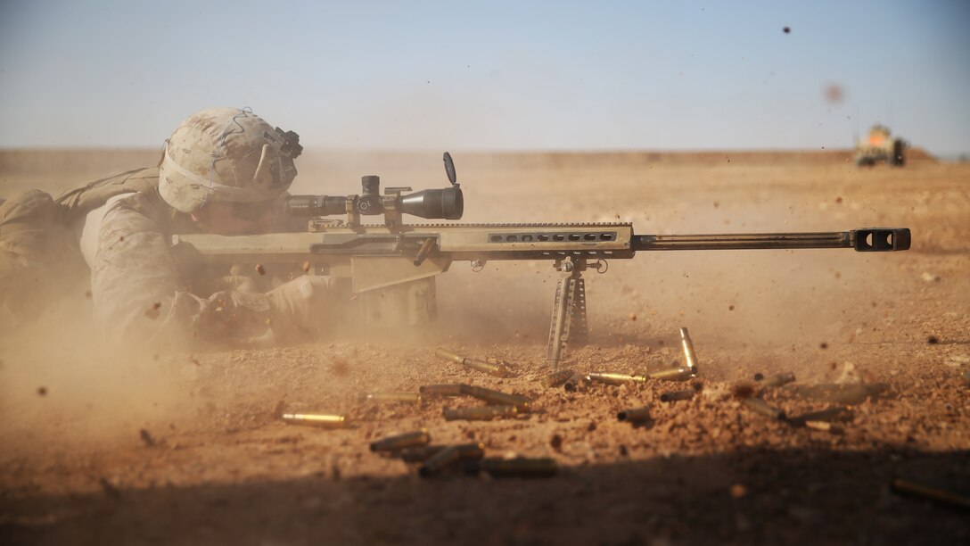 U.S. Marine Cpl. Kaden Prickett, machine gunner and team leader with Golf Company, 2nd Battalion, 7th Marine Regiment, Special Purpose Marine Air Ground Task Force-Crisis Response-Central Command, fires a .50 caliber Special Applications Scoped Rifle at a target 1,200 meters away, in the Central Command area of operations, Jan. 6, 2015. Marines and sailors of Golf Company spent time on the range getting acquainted with various weapons systems and cross-training one another in their respective areas of expertise. (U.S. Marine Corps photo by Cpl. Carson A. Gramley/Released)