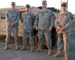 (From left to right) Staff Sgt. Daniel Martin, Grant, Ala., Capt. Todd Floyd, Cullman, Ala., Capt. Jeffery Campbell, Madison, Ala., and Staff Sgt. Lesly "Rich" Richardson, Toney, Ala., stand ready to deploy as the Alabama Army National Guard's first contingency contracting team (CCT). The four men make up the 1960th CCT. It is the second CTT from the Army National Guard to deploy to Afghanistan.