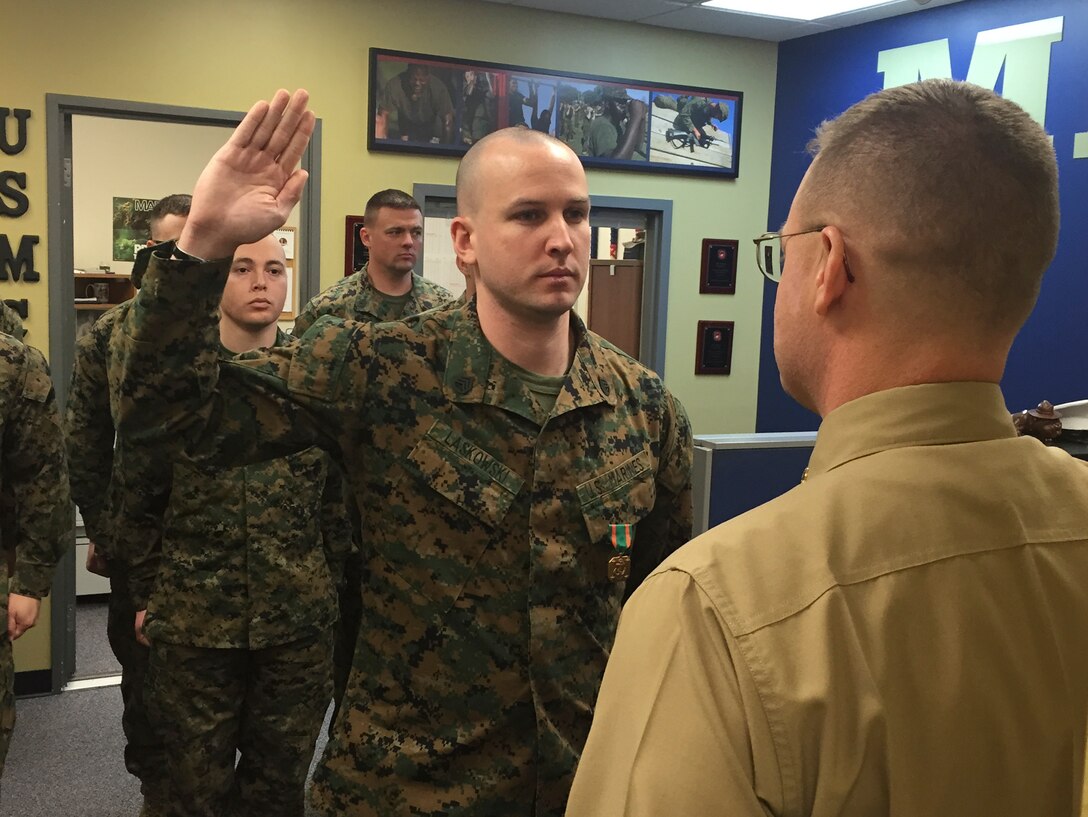 Staff Sgt. Michael R. Lawskoski, the staff non-commissioned officer in charge of Recruiting Sub-Station Newark, Recruiting Station Baltimore, reaffirms his oath of enlistment during his promotion ceremony that was held at RSS Newark, Delaware, January 5. Lawskowski, a native of Smithtown, New York, was recently named the 2014 Recruiter of the Year for RS Baltimore for which he received his first Navy and Marine Corps Achievement Medal. After graduating high school in 2003, Laskowski enlisted in the army and served as an infantryman. In 2007, Laskowski enlisted in the Marine Corps where he continued serving in the infantry military occupational specialty. He has completed three combat deployments, including tours in Iraq and Afghanistan, and is a recipient of the Purple Heart Medal. Laskowski served as the chief instructor for the Designated Marksman’s Course at Marine Corps Base Hawaii before transferring to RS Baltimore. (Photo courtesy of Gunnery Sgt. Robert Kelm)