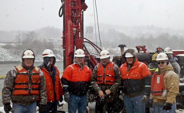 Pictured on the lock wall are left to right: Andy Harkness, INDC Deputy Chief; Kevin Gabig, district quality assurance; Mark Jones, district Engineering and Construction Division chief; Paul Surace,  district structural regional technical specialist; Brian McFarland, district lead engineer; and Dennis Zeveney,  district Dam and Levee Branch chief.  