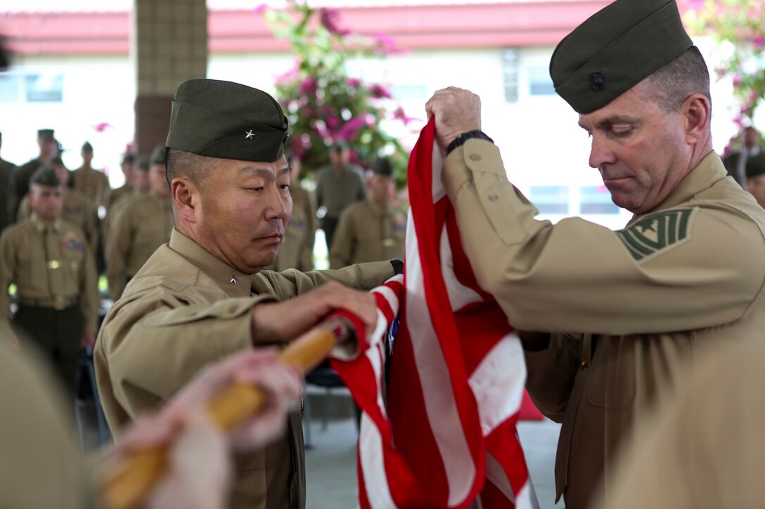 Brigadier Gen. Daniel D. Yoo, commanding general of Marine Expeditionary Brigade – Afghanistan, and Sgt. Maj. Doug Berry Jr., MEB-A sergeant major, prepare to case the national colors at a deactivation ceremony for MEB-A aboard Camp Pendleton, Calif., Jan. 9; symbolically closing another chapter in Marine Corps history following the 13-year conflict known as Operation Enduring Freedom. Marine Expeditionary Brigade - Afghanistan officially took authority of Regional Command (Southwest) from II Marine Expeditionary Force (Forward) Feb. 5, 2014, and assumed the responsibility to lead coalition operations in Helmand and Nimroz provinces. The Marines completed operations and departed Afghanistan Oct. 27, 2014.