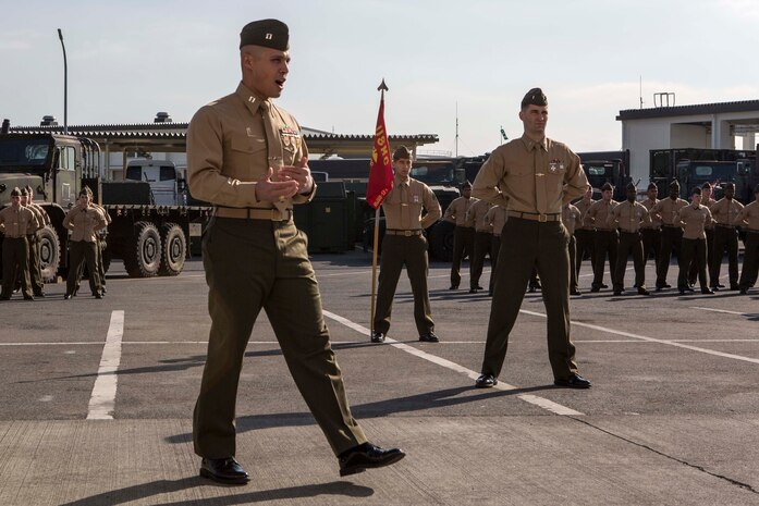 Capt. Kevin Wheeler, the newly appointed Motor Transport Company commander with Marine Wing Support Squadron 171, addresses his Marines during a change-of-command ceremony at the Motor-T lot, Jan. 9, 2015, aboard Marine Corps Air Station Iwakuni, Japan. Wheeler is taking the position from Capt. George Ivascu, the squadrons newly appointed assistant operations officer.