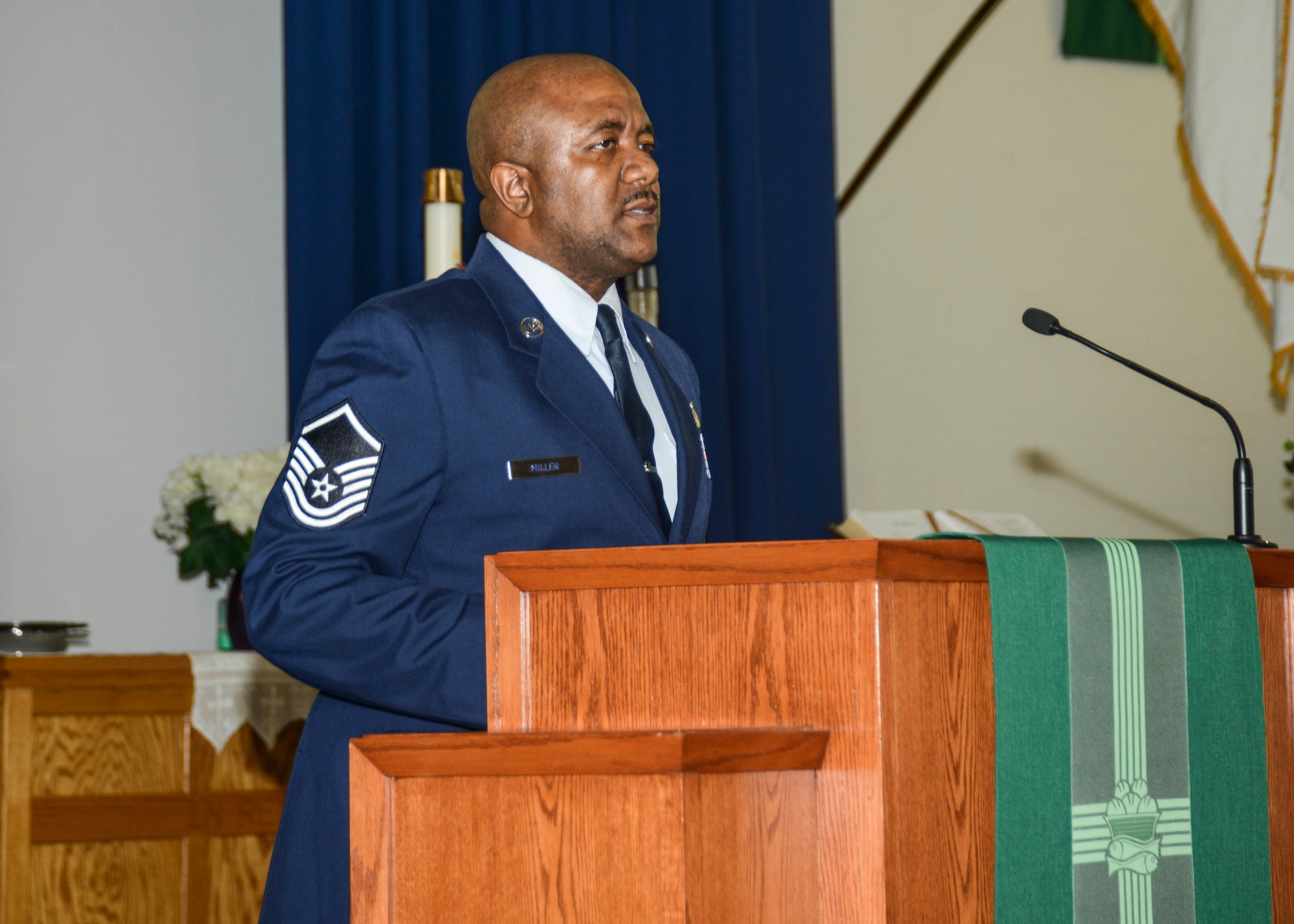 Master Sgt. Jarrod Miller, 412th Maintenance Group, read part of the famous “I Have a Dream” speech, which was delivered during the March on Washington for Jobs and Freedom in 1963. The commemorative march ended at Chapel 1 where members of Team Edwards gathered to remember the Rev. Dr. Martin Luther King Jr. and his influence on America. (U.S. Air Force photo by Rebecca Amber)