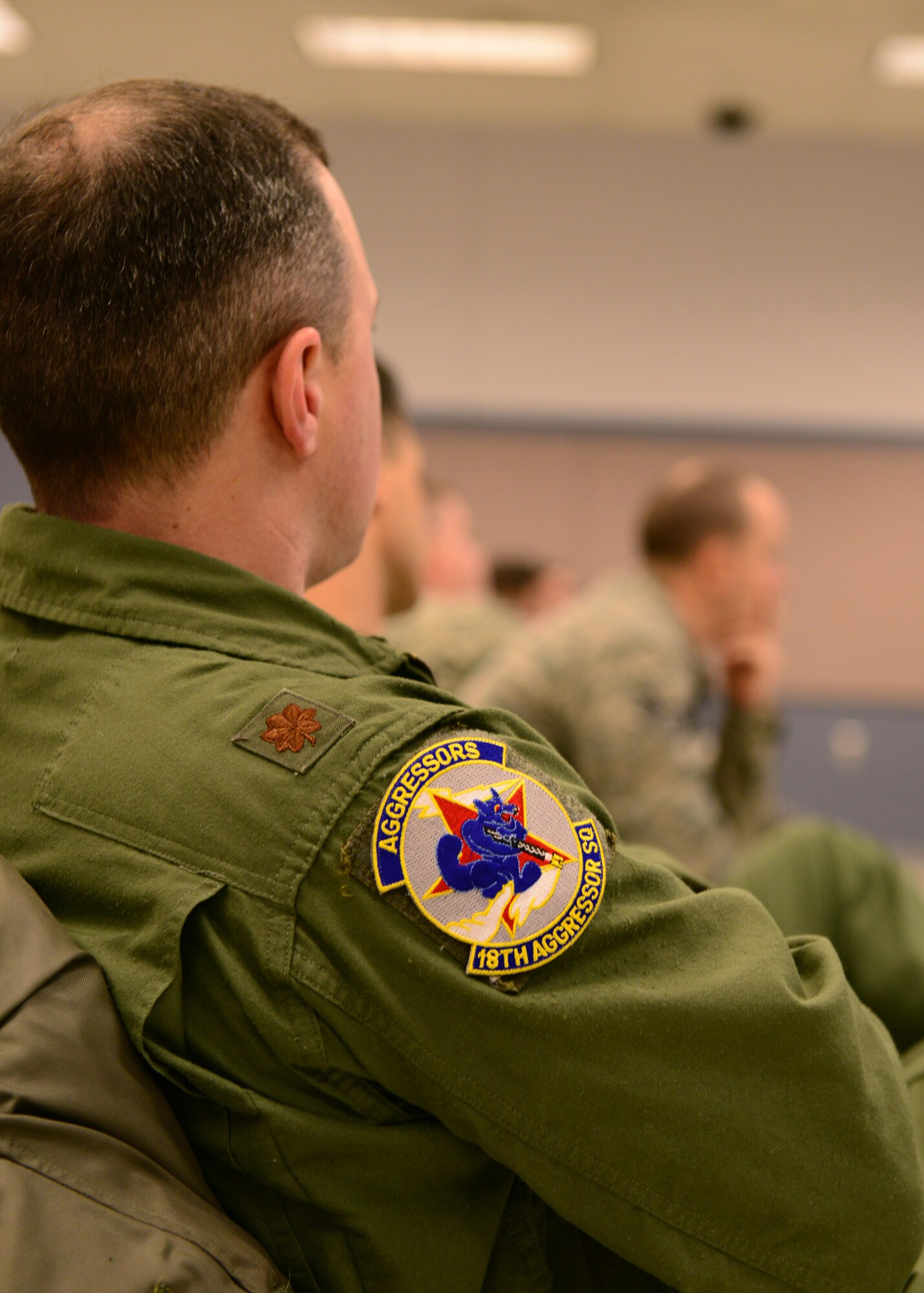 U.S. Air Force F-16 Fighting Falcon pilots and maintenance personnel assigned to the 18th Aggressor Squadron and 354th Maintenance Group, receive a pre-deployment brief Jan. 13, 2015, at the Stevens Joint Mobility Complex at Eielson Air Force Base, Alaska. More than 150 Airmen from the 354th Fighter Wing will participate in the Cope North exercise and are expected to complete more than 250 sorties. (U.S. Air Force photo by Senior Airman Ashley Nicole Taylor/Released)