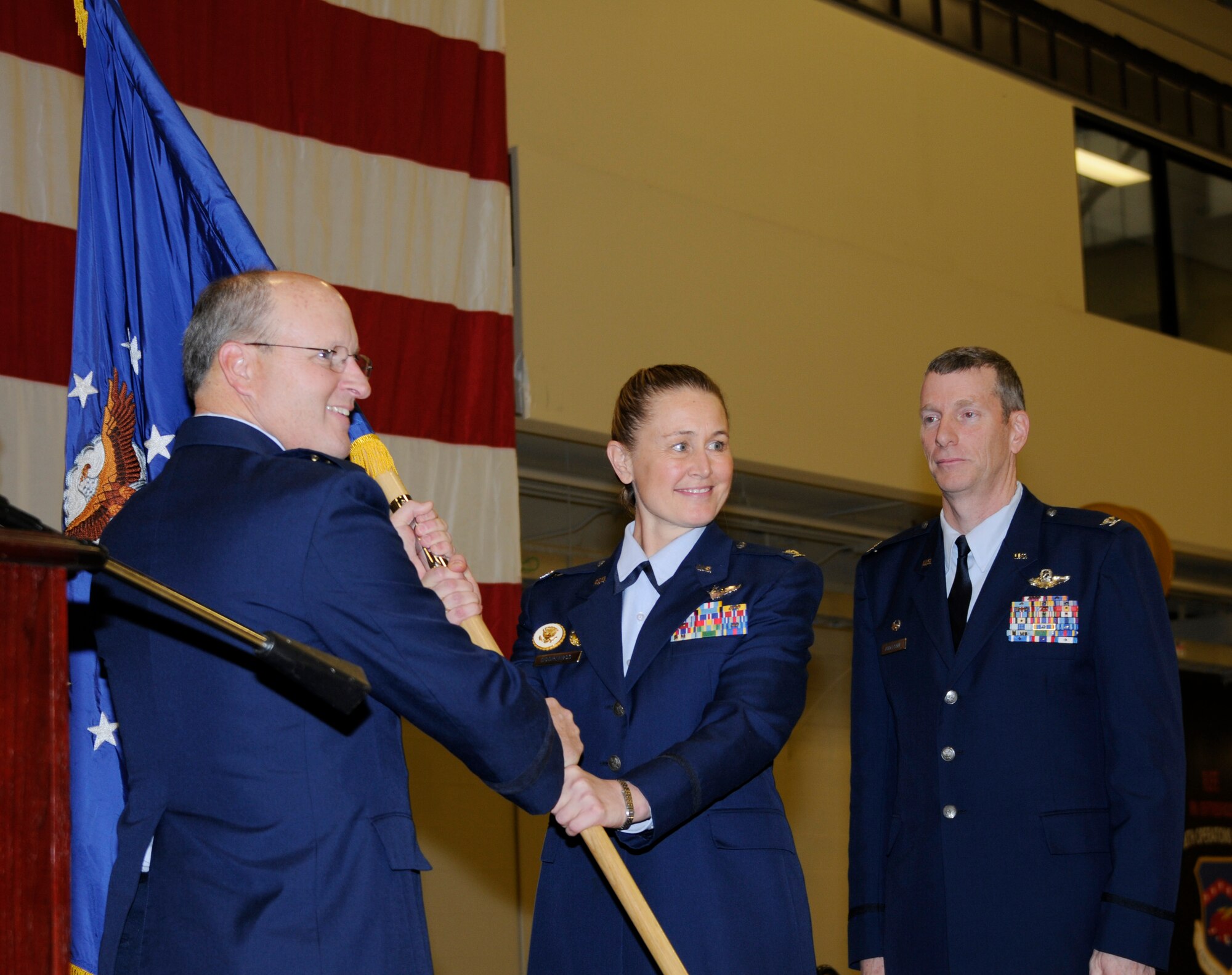 Col. Bobbi Doorenbos accepts the guidon from Brig. Gen. Travis Balch, commander of the Air National Guard, during a change of command ceremony held at Ebbing Air National Guard Base, Fort Smith, Ark., Jan. 11, 2015. Doorenbos, who is the former commander of the 214th Reconnaissance Group, assumed command of the 188th Wing from Col. Mark Anderson. (U.S. Air National Guard photo by Staff Sgt. Hannah Dickerson /released)