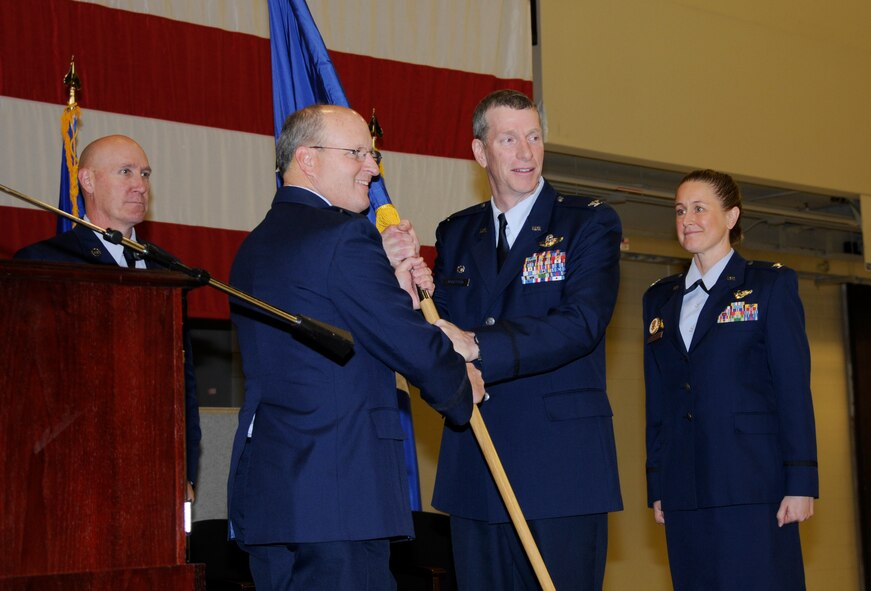 Col. Mark Anderson relinquishes command during the 188th Wing change of command ceremony Jan. 11, 2015, held at Ebbing Air National Guard Base, Fort Smith, Ark. Anderson will return to his civilian job at American Airlines after serving as the 188th Wing commander for nearly three years. (U.S. Air National Guard photo by Staff Sgt. Hannah Dickerson/released)