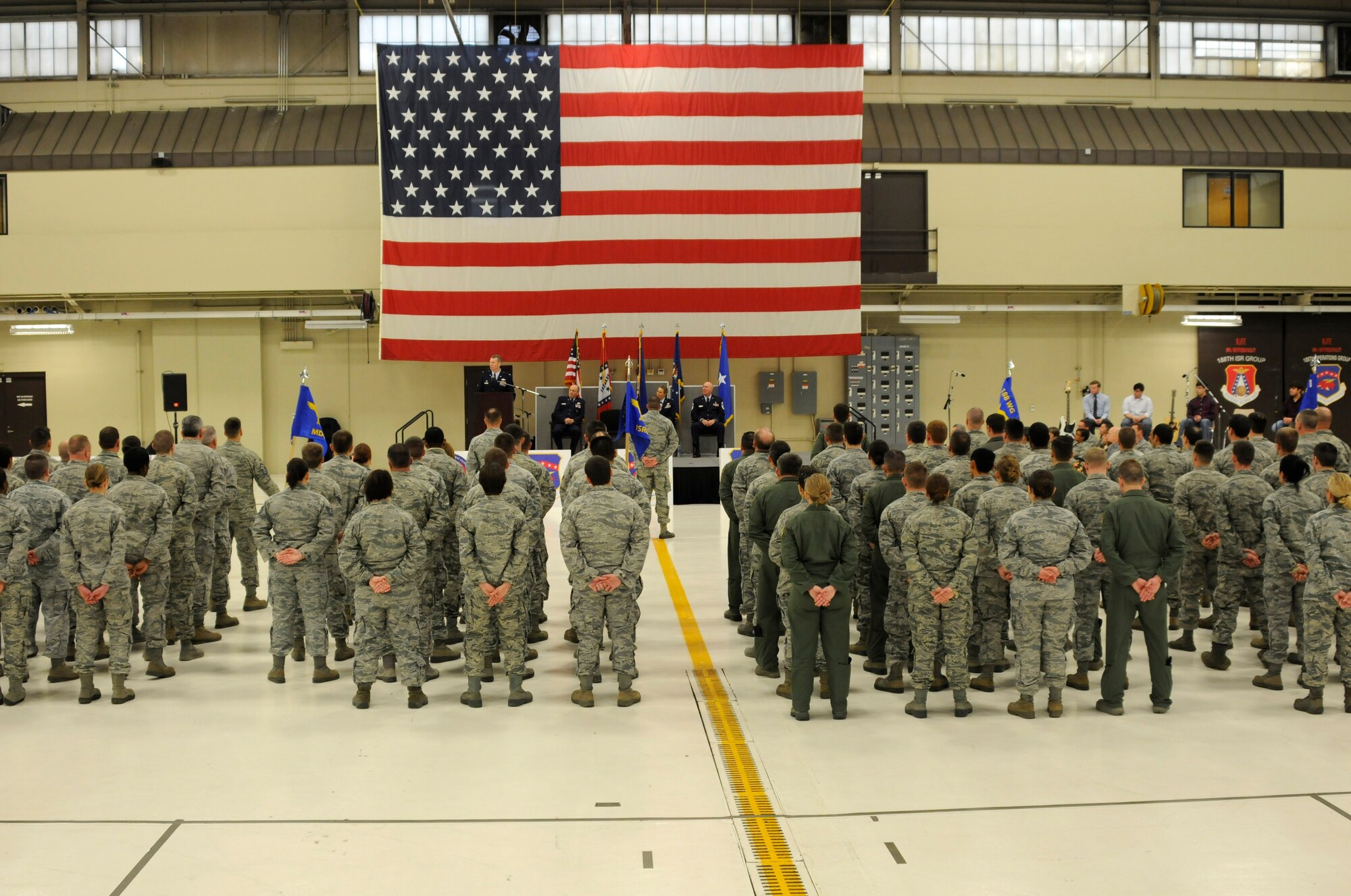 Members of the 188th Wing stand in formation during the 188th Wing change of command ceremony Jan. 11, 2015, held at Ebbing Air National Guard Base, Fort Smith, Ark.  During the ceremony Col. Bobbi Doorenbos became the first female to command the 188th Wing. Doorenbos assumed command after serving as the 214th Reconnaissance Group commander for the Arizona ANG at Davis-Monthan Air Force Base. (U.S. Air National Guard photo by Staff Sgt. Hannah Dickerson/released)