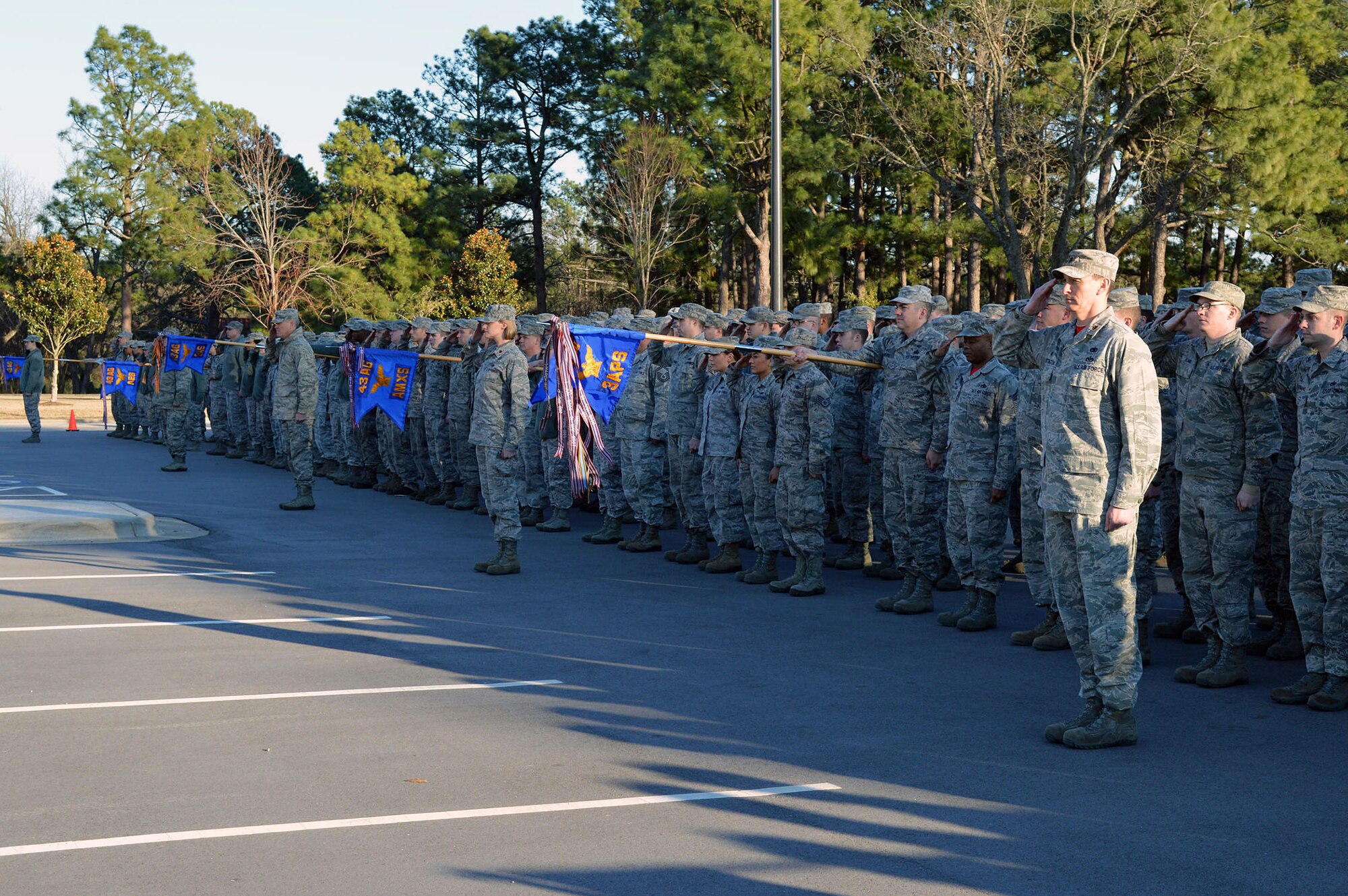 Over 300 Airmen from the 43rd Airlift Group participate in a retreat ceremony held at the Pope Field flagstaff on Jan. 9, Pope Army Airfield, North Carolina. Retreat, the retirement of the colors from the day's activities, is a ceremony in which the unit honors the U.S. flag when it is lowered in the evening. (U.S. Air Force photo/Marvin Krause)