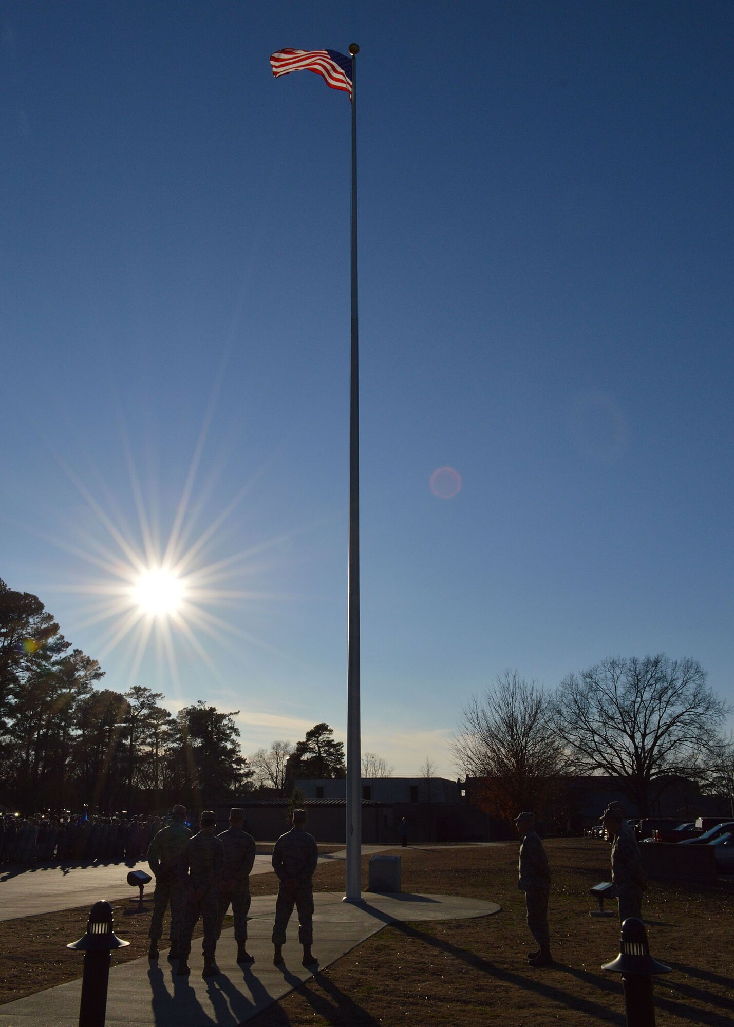 Over 300 Airmen from the 43rd Airlift Group participate in a retreat ceremony held at the Pope Field flagstaff on Jan. 9, Pope Army Airfield, North Carolina. Retreat, the retirement of the colors from the day's activities, is a ceremony in which the unit honors the U.S. flag when it is lowered in the evening. (U.S. Air Force photo/Marvin Krause)
