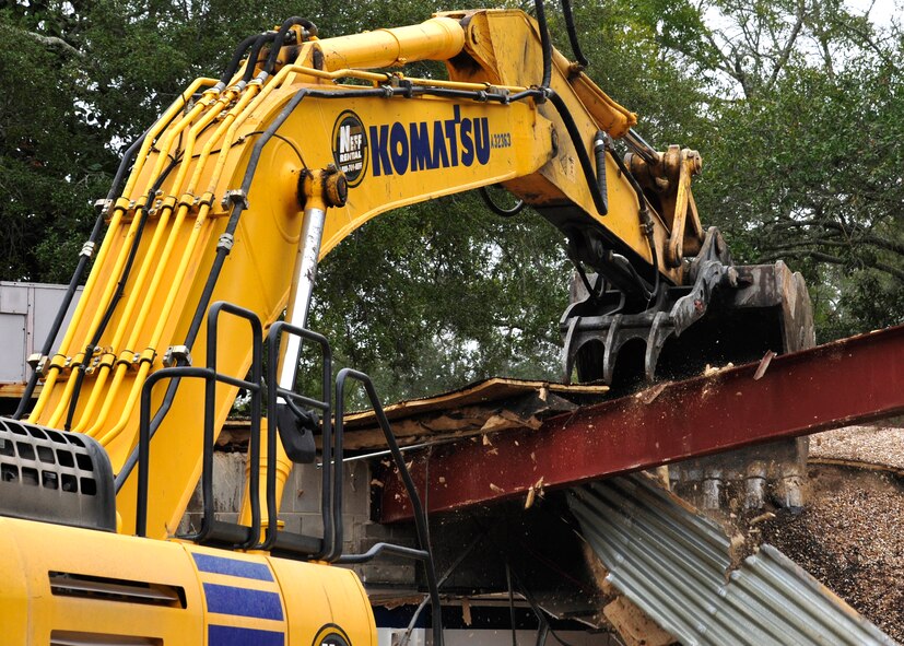 Personnel from the 96th Civil Engineer Group operate a demolition excavator to tear down Bldg. 606 in the former Federal Prison Camp compound at Eglin Air Force Base, Fla. on Jan. 12. The 24,529 square foot building was the dining facility for the inmates and guards and has been vacant since 2005. This building is considered excess, beyond economic repair and not usable. Demolition is estimated to be complete by the end of January. (U.S. Air Force photo/Ilka Cole)
