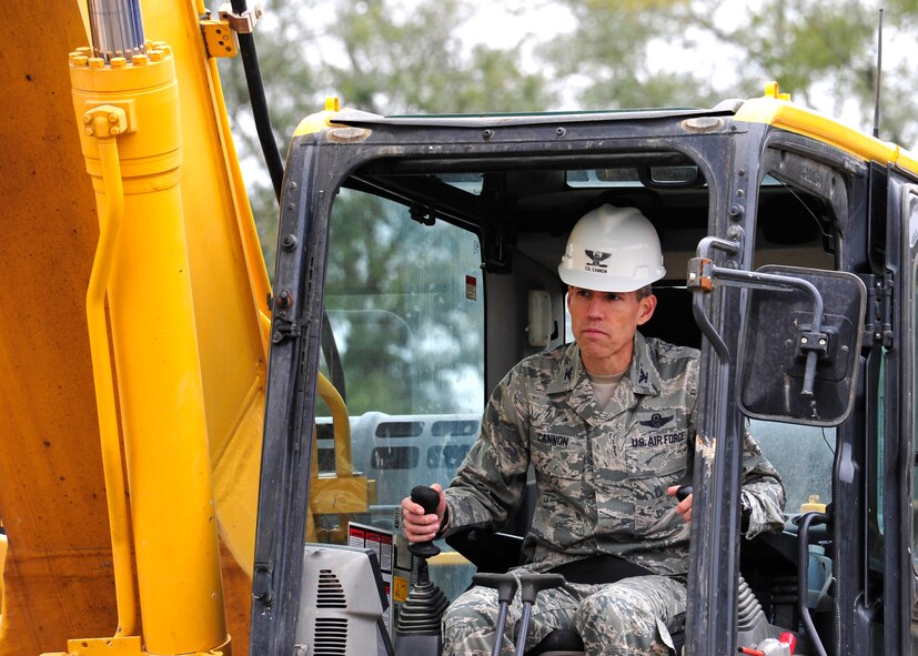Col. Monte Cannon, 96th Test Wing vice commander, operates a demolition excavator to tear down Bldg. 606 in the former Federal Prison Camp compound at Eglin Air Force Base, Fla. on Jan. 12. The 24,529 square foot building was the dining facility for the inmates and guards and has been vacant since 2005. This building is considered excess, beyond economic repair and not usable. Demolition is estimated to be complete by the end of January. (U.S. Air Force photo/Ilka Cole)